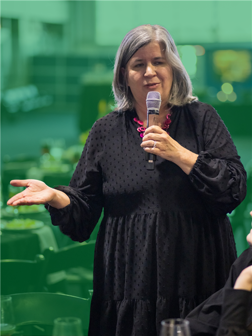 Female Retiree with a mic